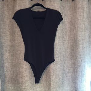 Black short sleeve v neck body suit.
